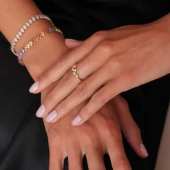 Bague 7 zircons blanc acier doré or