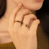 Bague Mains acier doré or