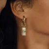 Boucles Topia blanches acier doré or